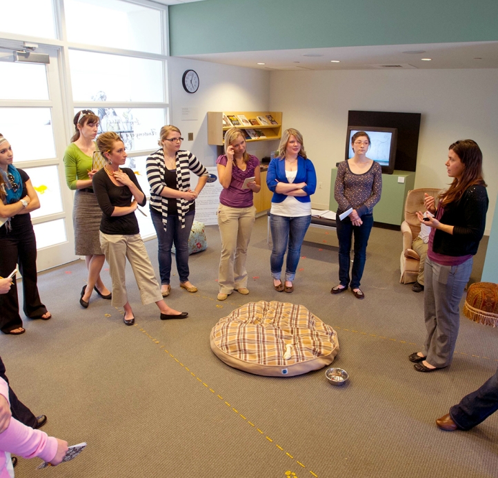 Art education students standing in a circle