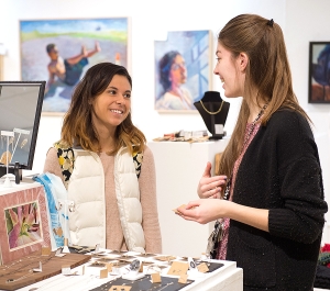 Two students at the Student Art Sale