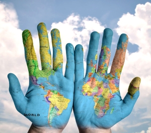 Hands painted with the world