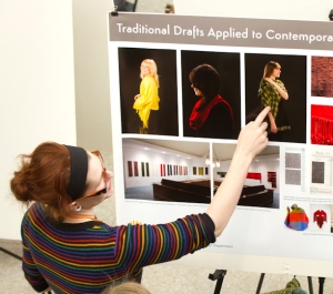 Student with a poster presentation