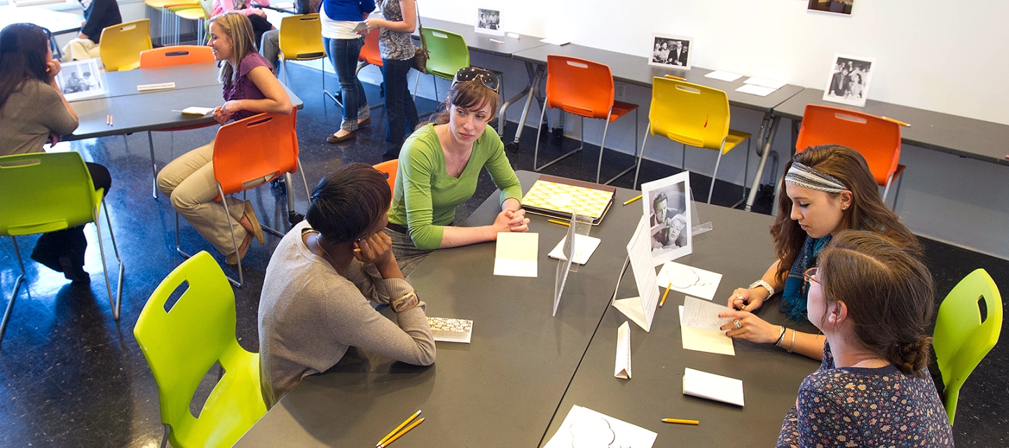 Art education students at tables in a workshop